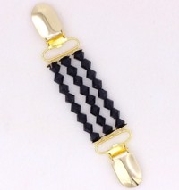 Broche/cardigan lukker - guld med sorte facetsten 